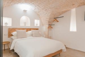 En eller flere senge i et værelse på Dimore Bianche, l'Immacolata + 37 billeder