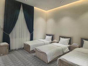 Ένα ή περισσότερα κρεβάτια σε δωμάτιο στο Shinam Hostel