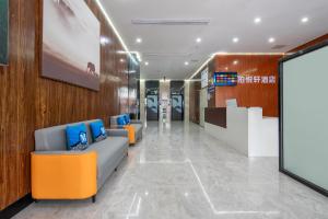 an office lobby with orange and blue furniture at Park Hyatt Hotel in Taiping