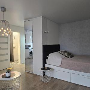 Giường trong phòng chung tại Buto nuoma Šviesos gatvėje