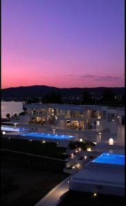 a view of a building at night with lights at OLYN VILLAS in Nikiti