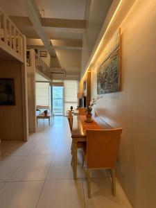 a dining room with a long table and chairs at Pico de loro in Nasugbu