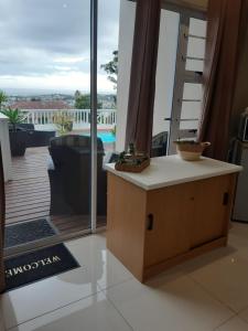 a room with a view of a balcony with a table at THE VIEW in Port Alfred