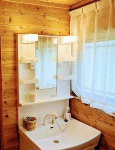 a bathroom with a sink and a mirror at Aso Dream Villa - Vacation STAY 17297 in Okurabaru +47 photos