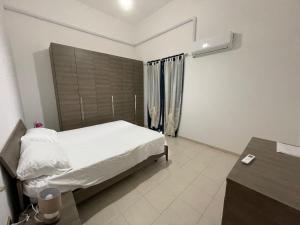 Ένα ή περισσότερα κρεβάτια σε δωμάτιο στο Casa Vacanze Vittoria