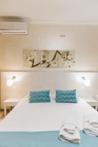 Ένα ή περισσότερα κρεβάτια σε δωμάτιο στο Mediterranea Sea House