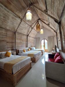 En eller flere senge i et værelse på Daghan Cottage Nusa Penida
