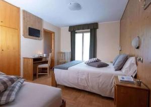 En eller flere senge i et værelse på Hotel Cima Piazzi + 69 billeder