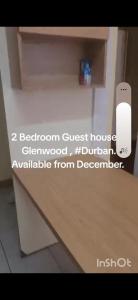 a sign that says reborn guest house cloned at 16 Laburnum lodge in Durban