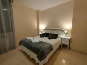 Ένα ή περισσότερα κρεβάτια σε δωμάτιο στο Acogedor Apartamento