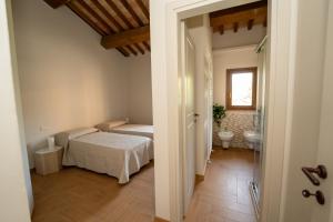 Postel nebo postele na pokoji v ubytování Borgo RE