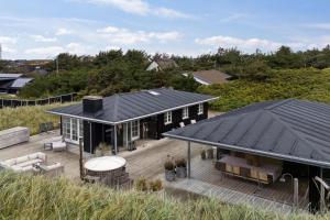 an aerial view of a house with a deck at Feriehus 1142 in Ringkøbing