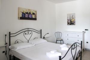 Postel nebo postele na pokoji v ubytování Borgo Tortorella by IL PUMO DI PUGLIA