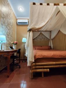 En eller flere senge i et værelse på Villa Jasmine 2BR with pool