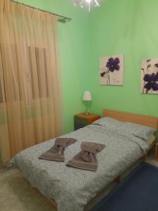 Ένα ή περισσότερα κρεβάτια σε δωμάτιο στο Home of Dreams