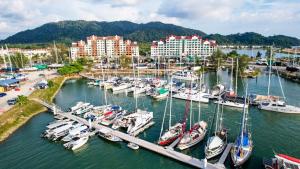 a bunch of boats docked in a marina at Marina Island Lumut 3 Bedroom Holiday Apartment in Lumut