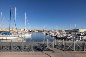 a bunch of boats docked in a marina at Gran Suite Darsena in Isola Sacra