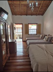 Ένα ή περισσότερα κρεβάτια σε δωμάτιο στο Pedacinho do céu