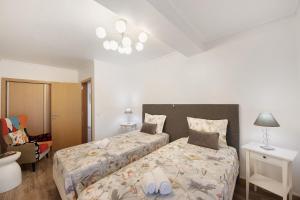 Postel nebo postele na pokoji v ubytování Aveiro Le petit venise du portugal