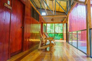 a room with a chair in the middle of a building at Jodokus Inn in Montezuma