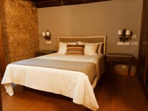 Postel nebo postele na pokoji v ubytování Vila As Pedras + 56 fotografií