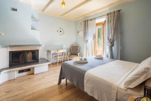 Кровать или кровати в номере Agriturismo Le Casaline +77 фотографий