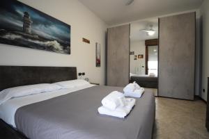 Ένα ή περισσότερα κρεβάτια σε δωμάτιο στο La Casa di Dante Bologna