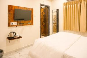 En eller flere senge i et værelse på Sterlinge Homestay