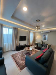 a living room with a couch and a table at Maison Aria in Madina +25 photos