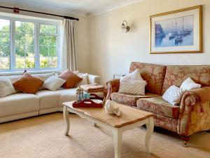 a living room with a couch and a coffee table at Harbourside in Poole