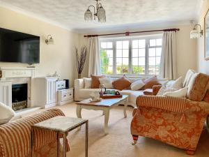 a living room with a couch and a table at Harbourside in Poole