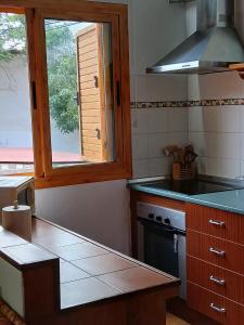 Kuchyň nebo kuchyňský kout v ubytování Casa Rural Carmita