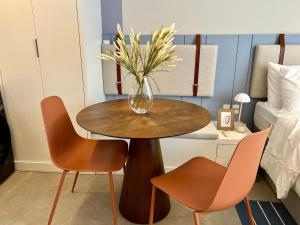 En eller flere senge i et værelse på Studio Moderno na Velha, perto da Vila Germânica