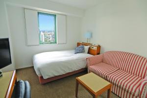 Postel nebo postele na pokoji v ubytování 青森フォレストホテル アネックス