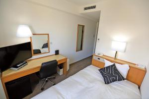 Postel nebo postele na pokoji v ubytování 青森フォレストホテル アネックス