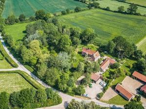 an overhead view of a house with a road and trees at Sparrows Nest - Uk50109 in Longham
