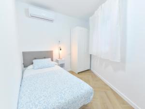 Ένα ή περισσότερα κρεβάτια σε δωμάτιο στο Algaba Málaga Casita