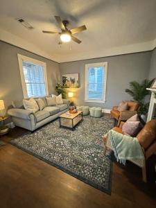 a living room with a couch and a table at Downtown, Updated, Single Story & WD in Columbus