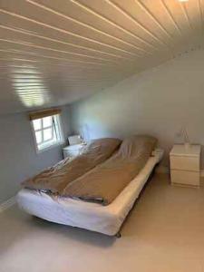 a bedroom with a large bed in a room at Holiday Home With Outdoor Pool, Great Location in Hornsved