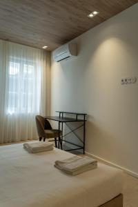 Postel nebo postele na pokoji v ubytování ORM - Santa Teresa Apartments