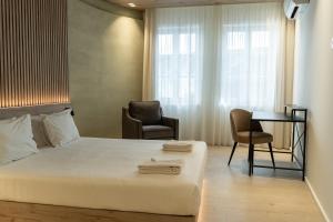 Postel nebo postele na pokoji v ubytování ORM - Santa Teresa Apartments