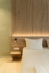 Postel nebo postele na pokoji v ubytování ORM - Santa Teresa Apartments