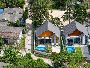 an aerial view of a house with a swimming pool at Villa Kokini in Koh Samui