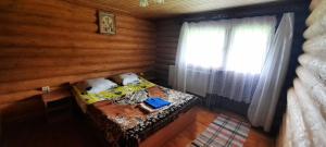 En eller flere senge i et værelse på Гукливчик