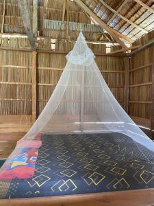 Ένα ή περισσότερα κρεβάτια σε δωμάτιο στο Arwo Homestay +18 φωτογραφίες