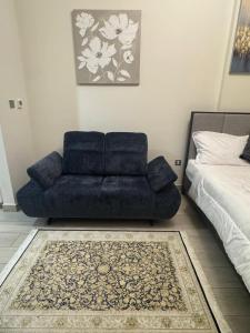 Кровать или кровати в номере Sophisticated Studio Designer Interiors