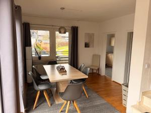a dining room with a table and chairs at Fewo Zentral in Willingen