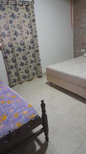 Ένα ή περισσότερα κρεβάτια σε δωμάτιο στο Alquiler Casa Tafi del Valle