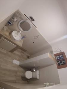 an overhead view of a bathroom with a sink at Malaika White House Apartment & Spa in Kiwengwa +19 photos