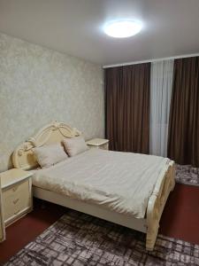 En eller flere senge i et værelse på Cozy apartment